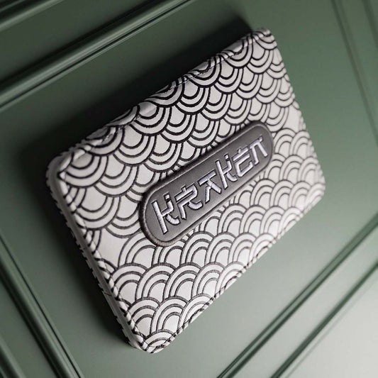 White Seigaiha yardage book holder with black embroidered Japanese wave pattern and graphite KRAKEN badge, Kraken Golf