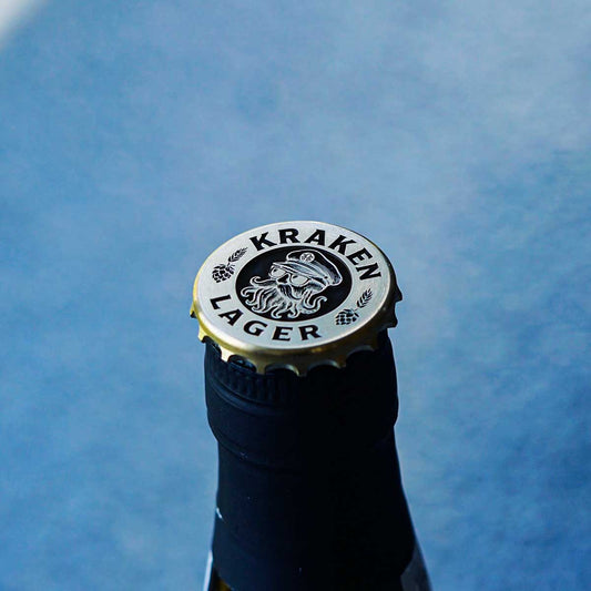 Closeup of skull in captain hat engraving with tentacle beard on brass marker