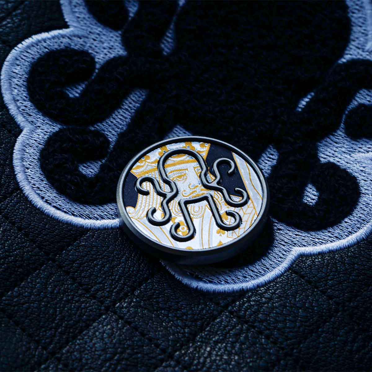 Kraken Royal Flush stainless steel golf ball marker with black vinyl card inlay
