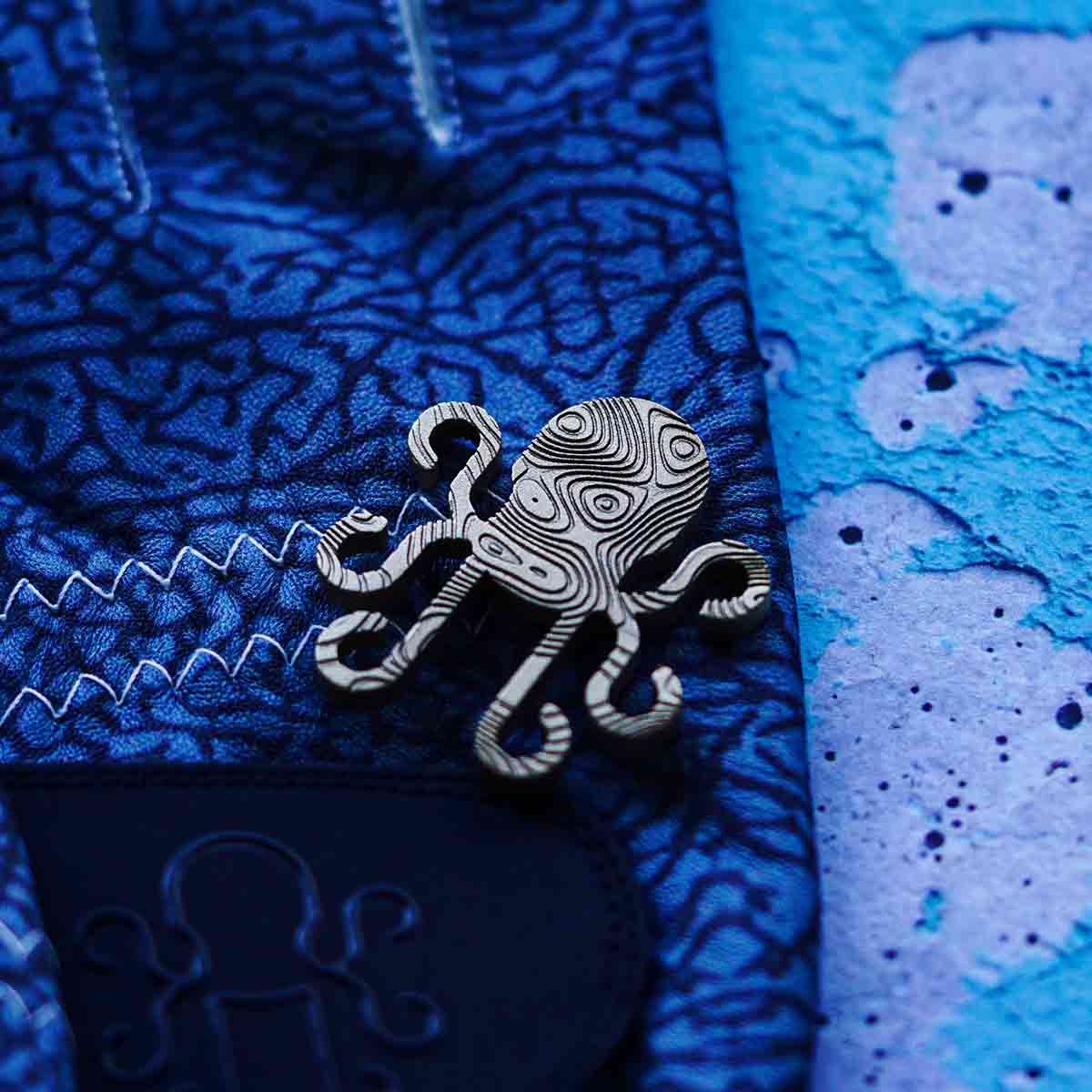 Kraken Golf ball marker in the Kraken logo shape