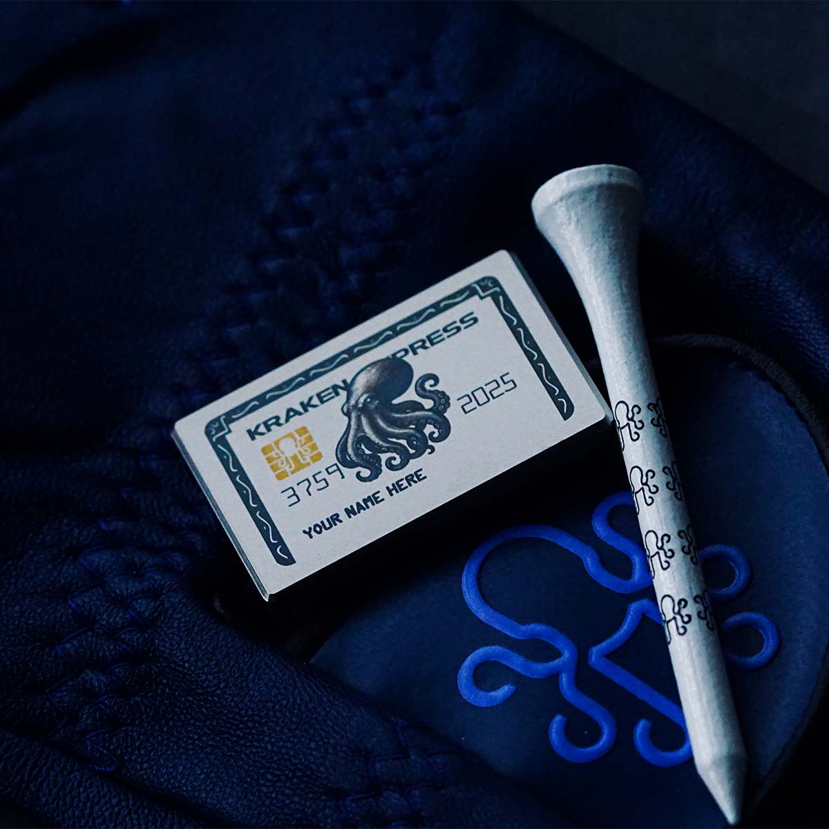 Silver Express titanium golf ball marker with engraved Kraken graphic