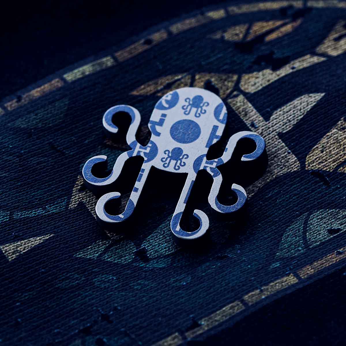 kraken logo titanium ball marker luxury macro shot