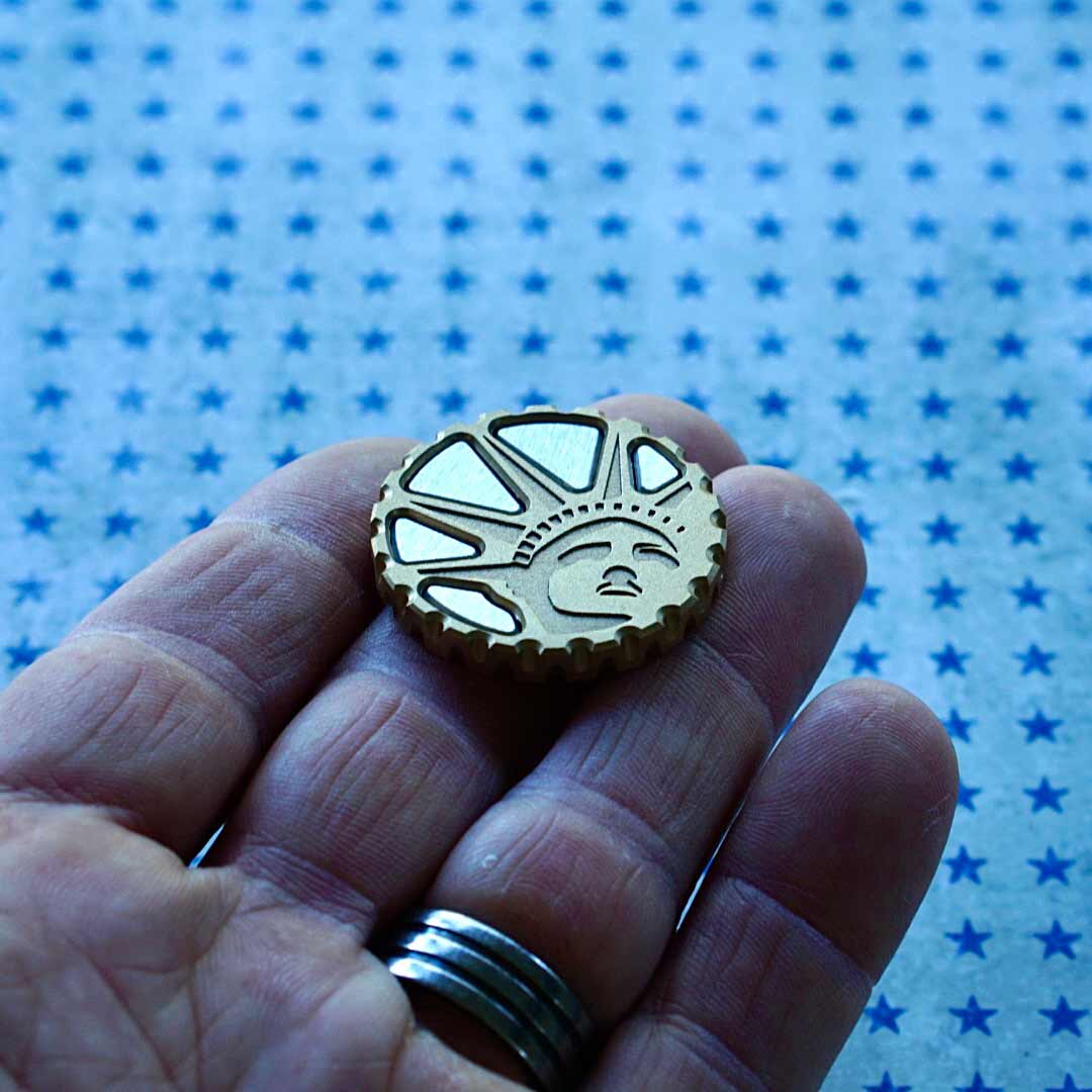 Brass golf ball marker weighing 35 grams with 1.35 inch diameter - Kraken Golf specs