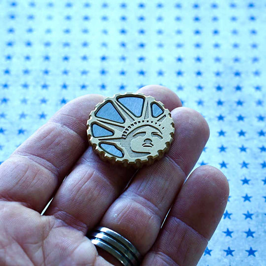 Brass golf ball marker with engraved Lady Liberty and aluminum inlays - Kraken Golf limited edition