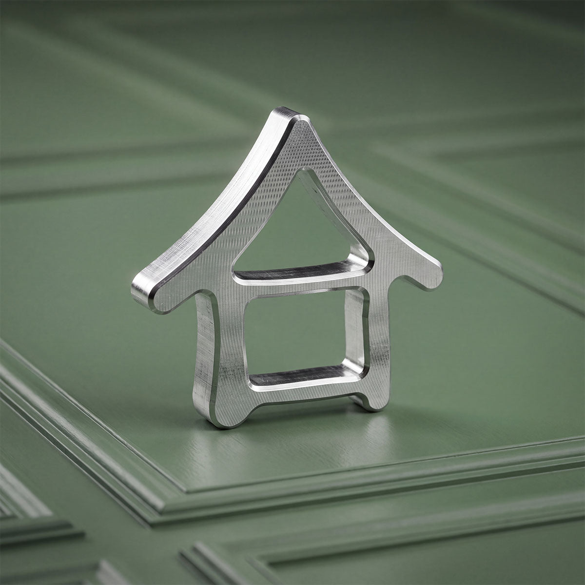 Machiya House Mark ball marker from above showing Kyoto rooftop silhouette with window and gable cutouts