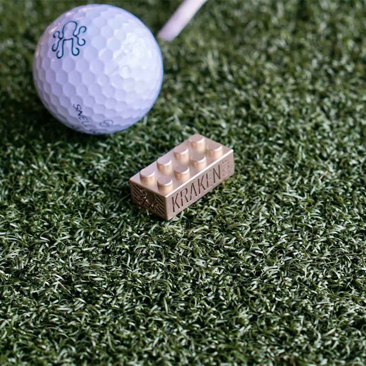 Top view of Mamba Mentality Brix marker with 8 raised brass prongs and satin finish