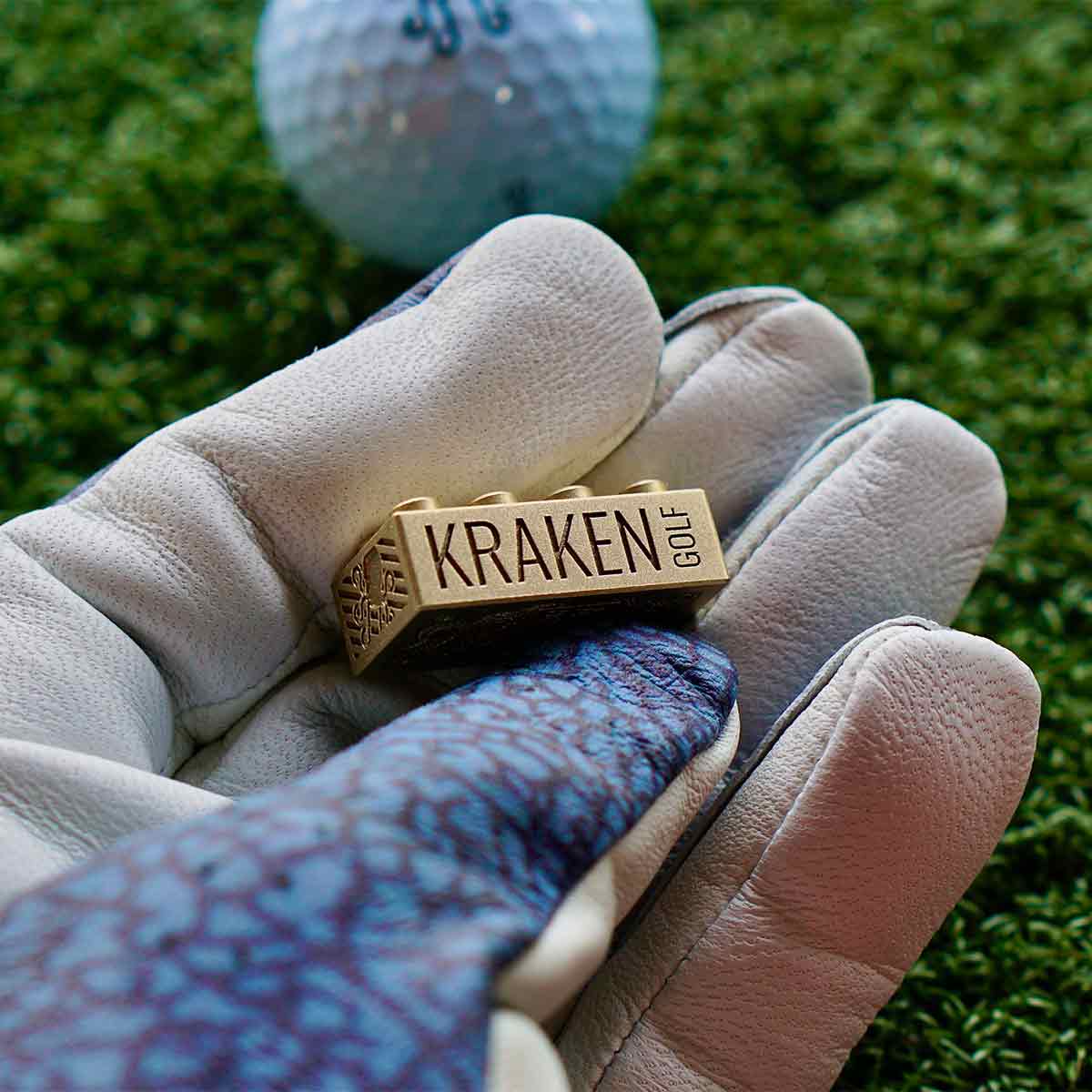 Side view of Brix marker with KRAKEN GOLF engraved in bold blackened letters