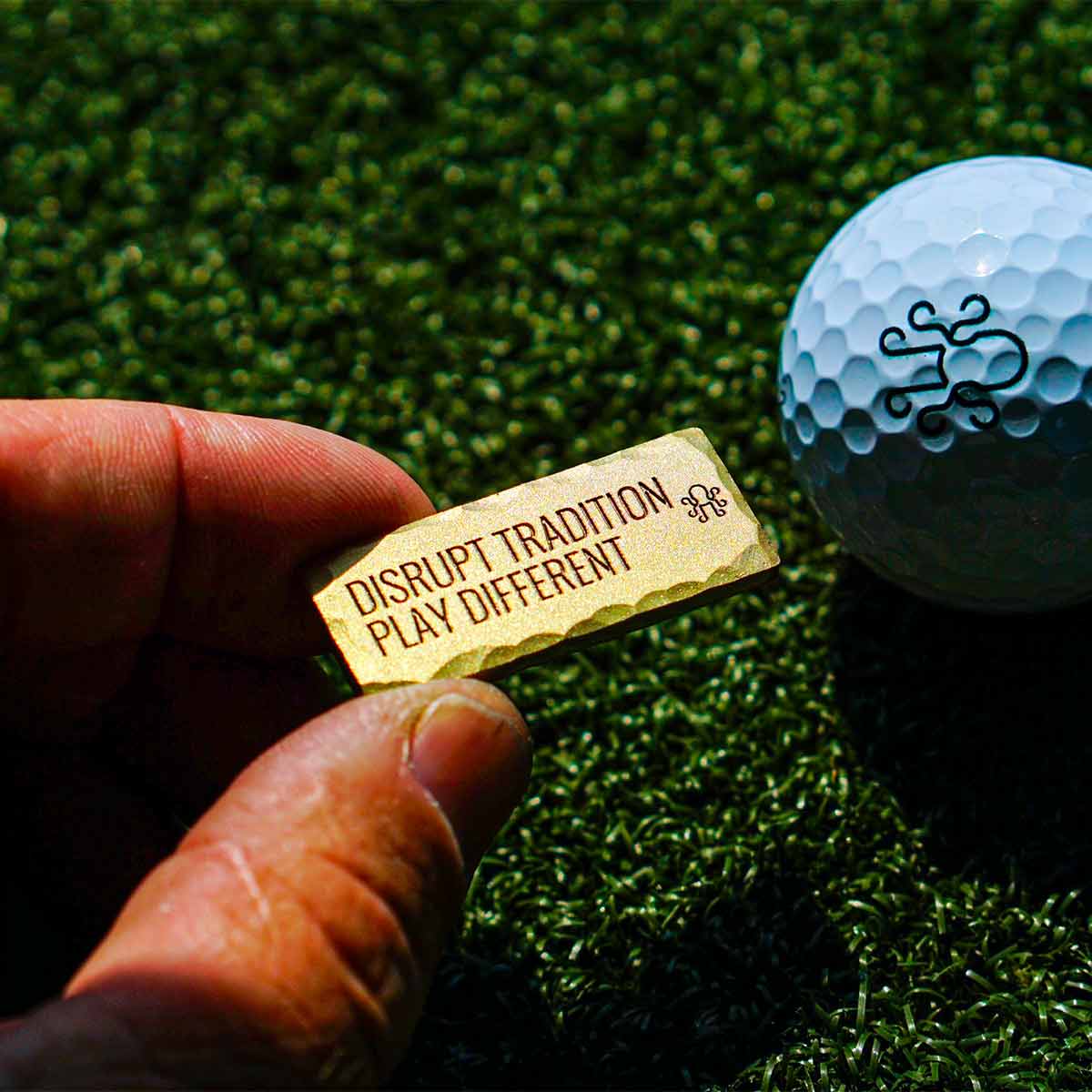 Reverse side of Kraken Golf $100 marker showing engraved collector message