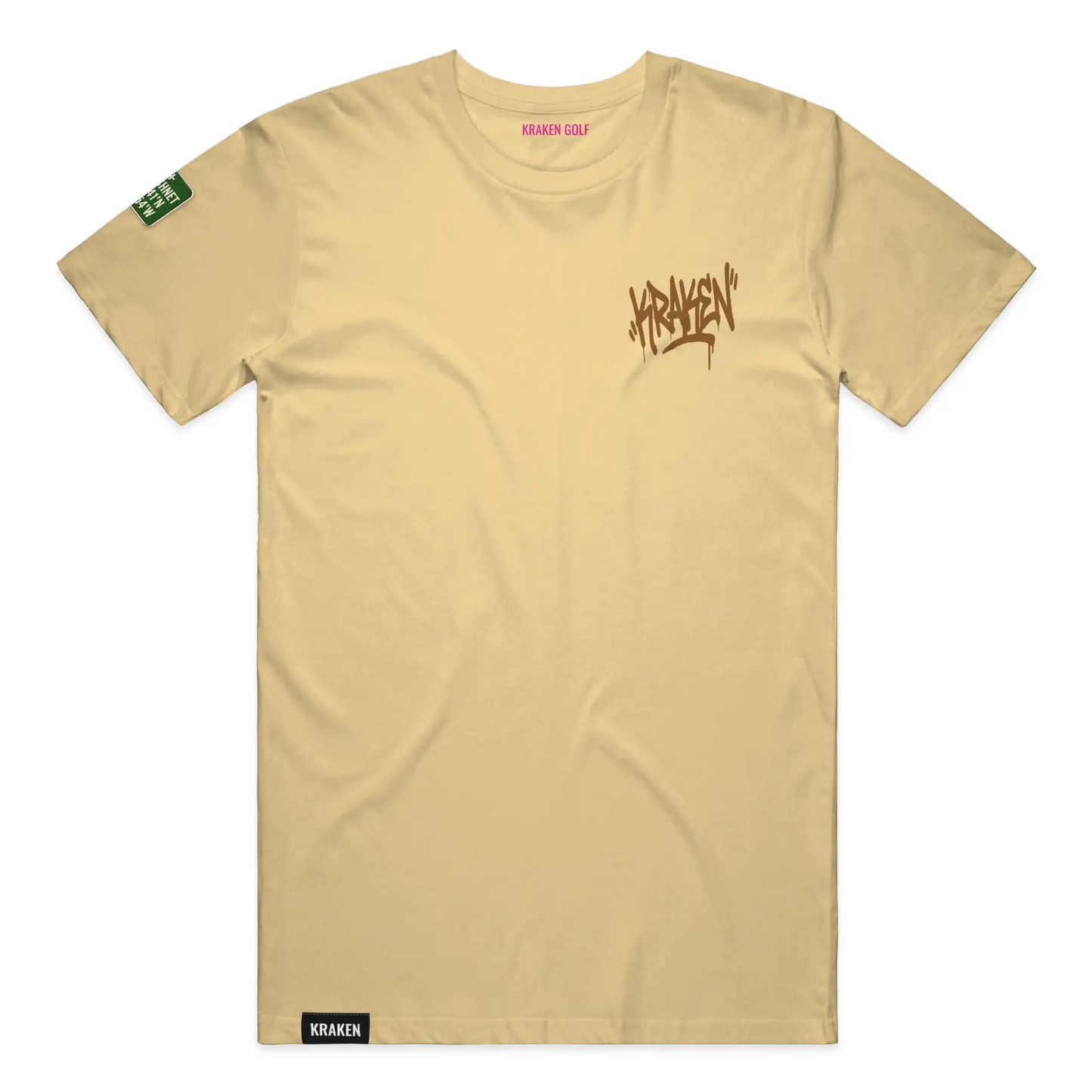 Left chest detail of the butter Origin tee showing the brown Kraken graffiti tag on heavyweight garment-dyed cotton