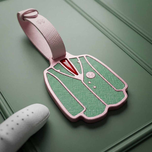 Patron Pass Bag Tag golf bag tag in brass or copper with green and white Saffiano leather inlays and white leather strap
