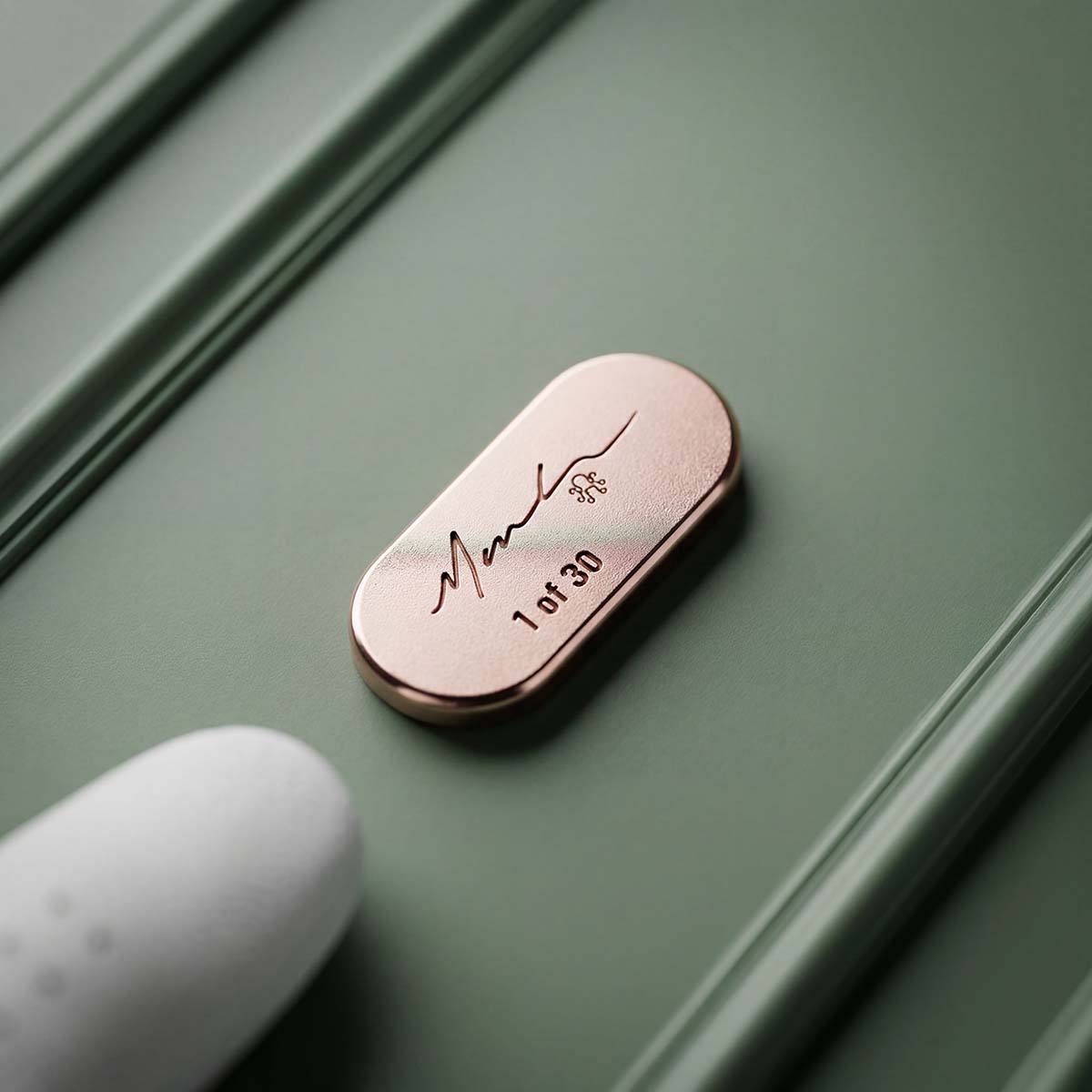 Poison Pill ball marker verso showing hand signature and individual number 1 of 30 under the Kraken seal