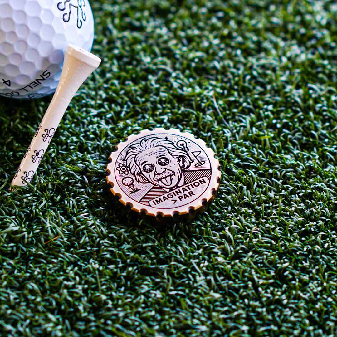 Einstein-inspired brass ball marker with engraved aluminum hair, Kraken logo eyes, and black-and-white leather inlays - Relativity Drop by Kraken Golf