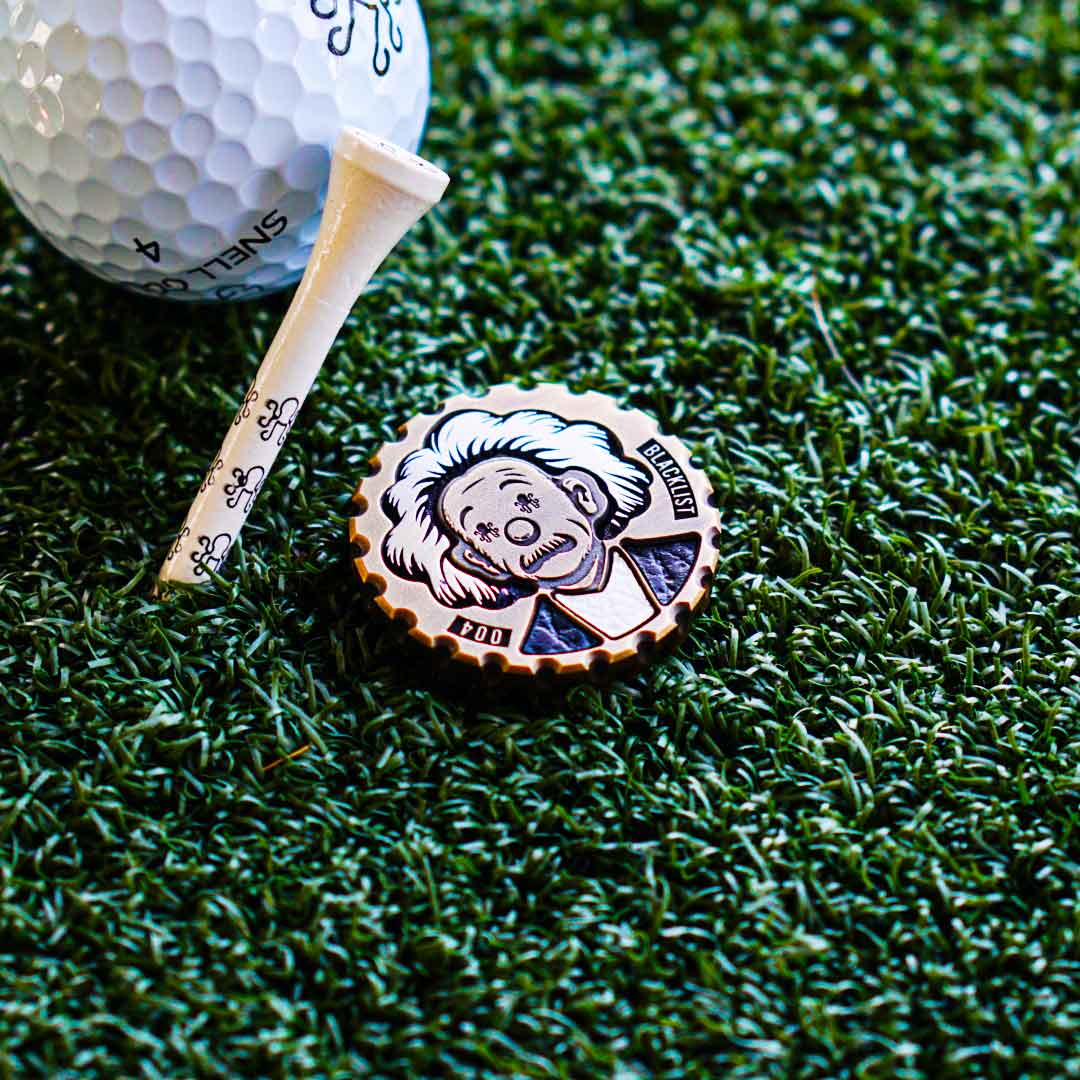 Brass Einstein golf ball marker with aluminum hair and leather inlays - Kraken Golf Relativity Drop