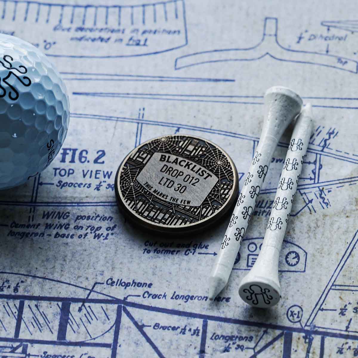 Luxury Halloween-themed golf ball marker from Kraken Golf displayed on green with dramatic lighting