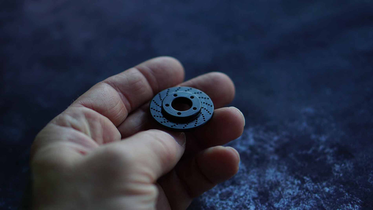 
                Rotor Golf Ball Marker - Black Oxide Carbon Steel | Kraken Golf – Story Behind Image
              