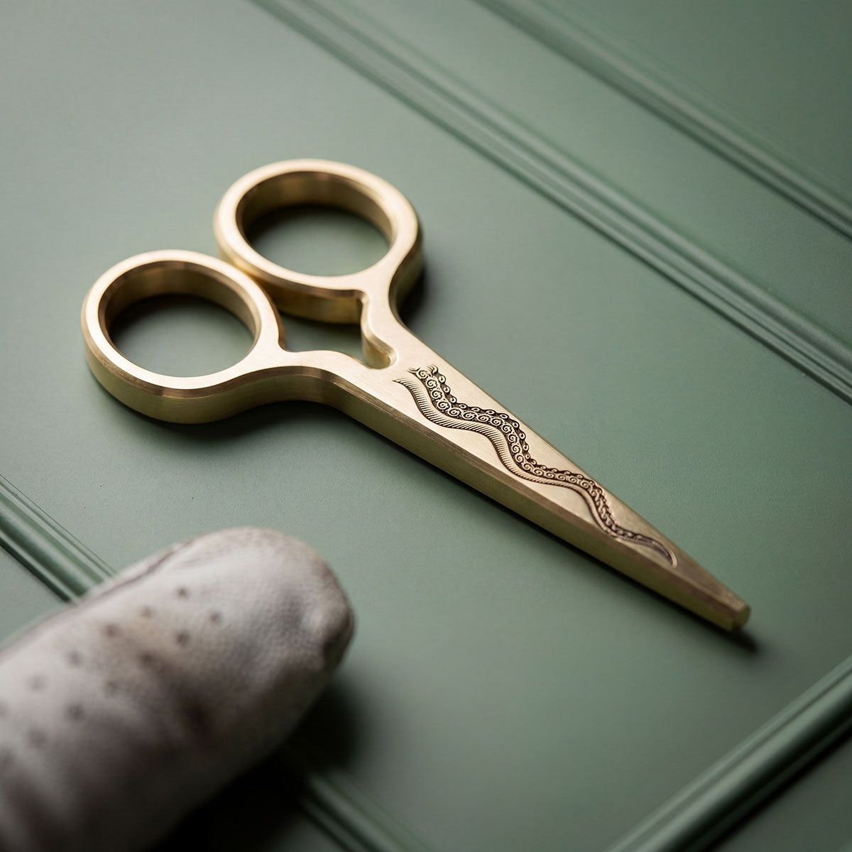 The Serpent's Edge brass golf pitch tool with hand-engraved Kraken tentacle by Kraken Golf