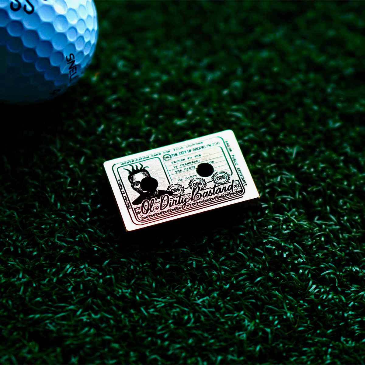 Shaolin Classic cassette ball marker back view with engraved ODB food stamp card