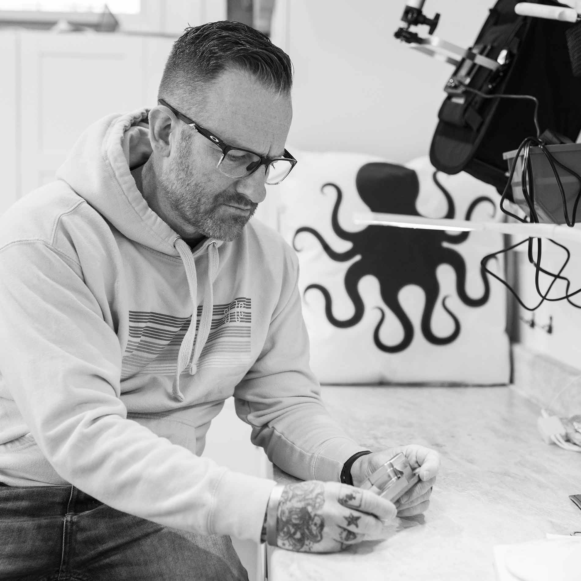 Kraken Golf founder - Marc Cordeira examining a putter in the shop