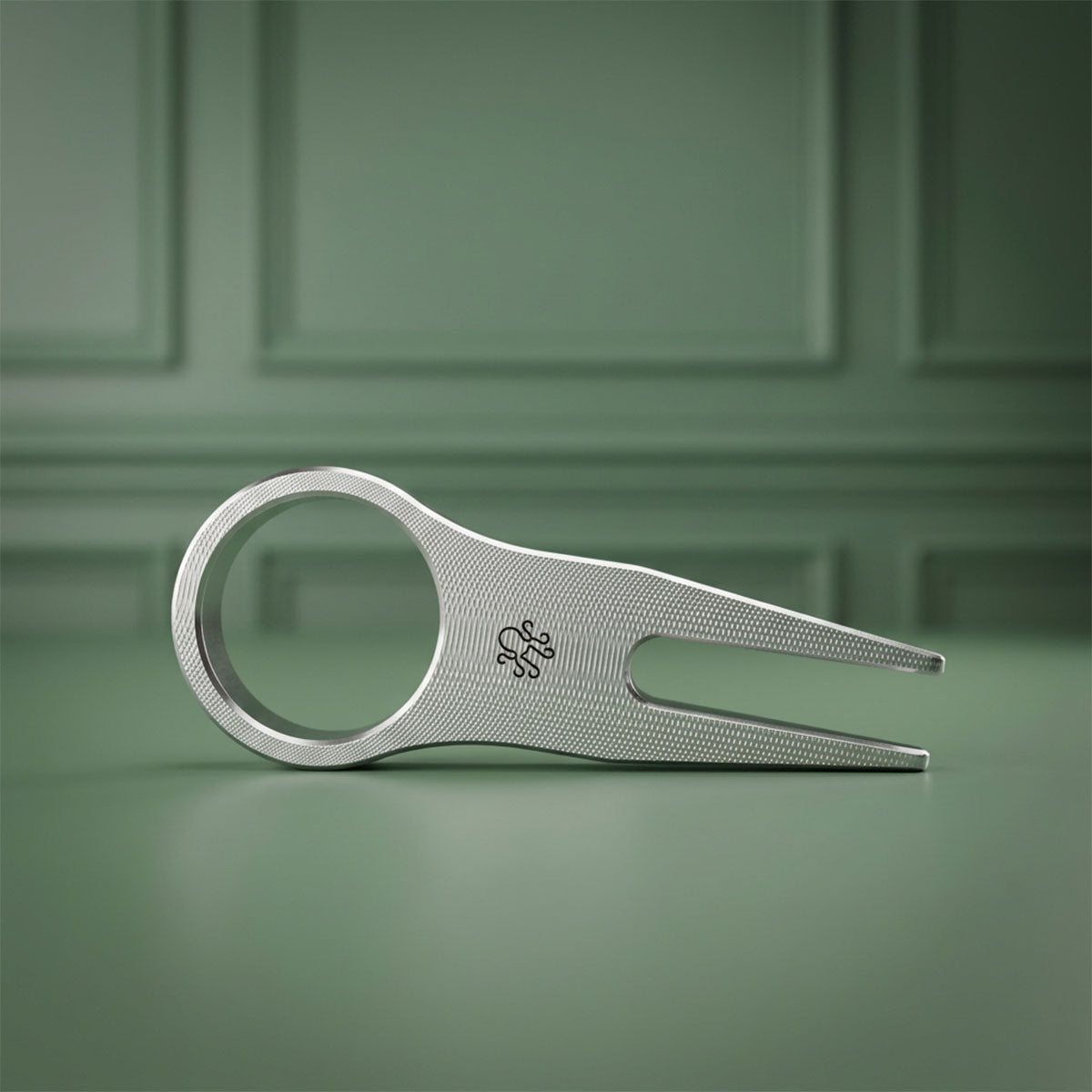 Kraken Golf emblem engraved on reverse side of The Signet pitch tool