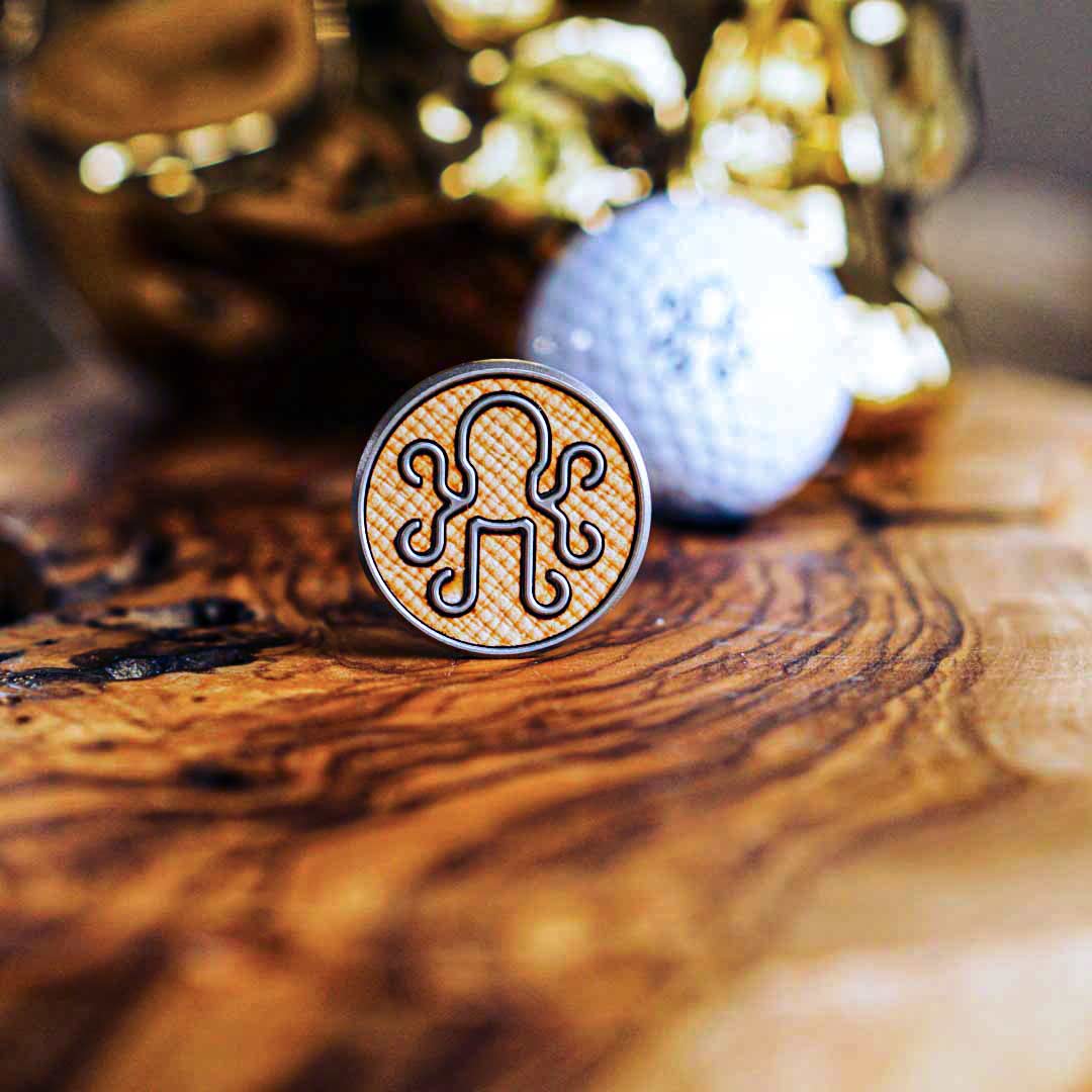 Stainless steel Autobahn ball marker featuring a sleek Italian leather inlay, blending precision engineering with luxury craftsmanship.