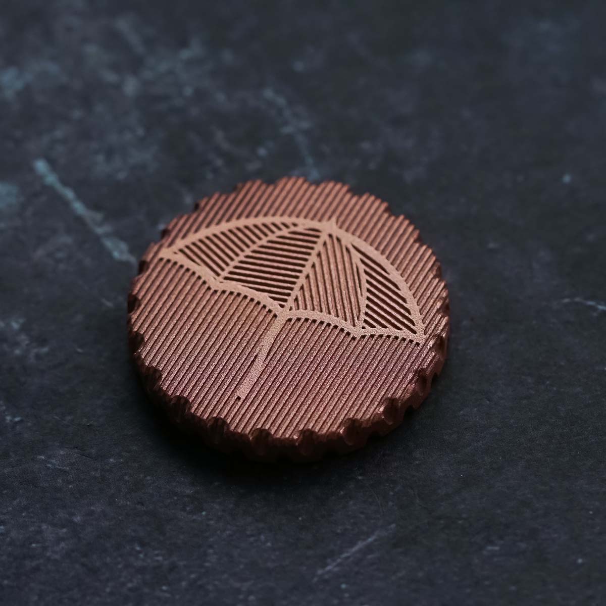 Back view of The Half & Half marker with umbrella hatch engraving and rain hatch background