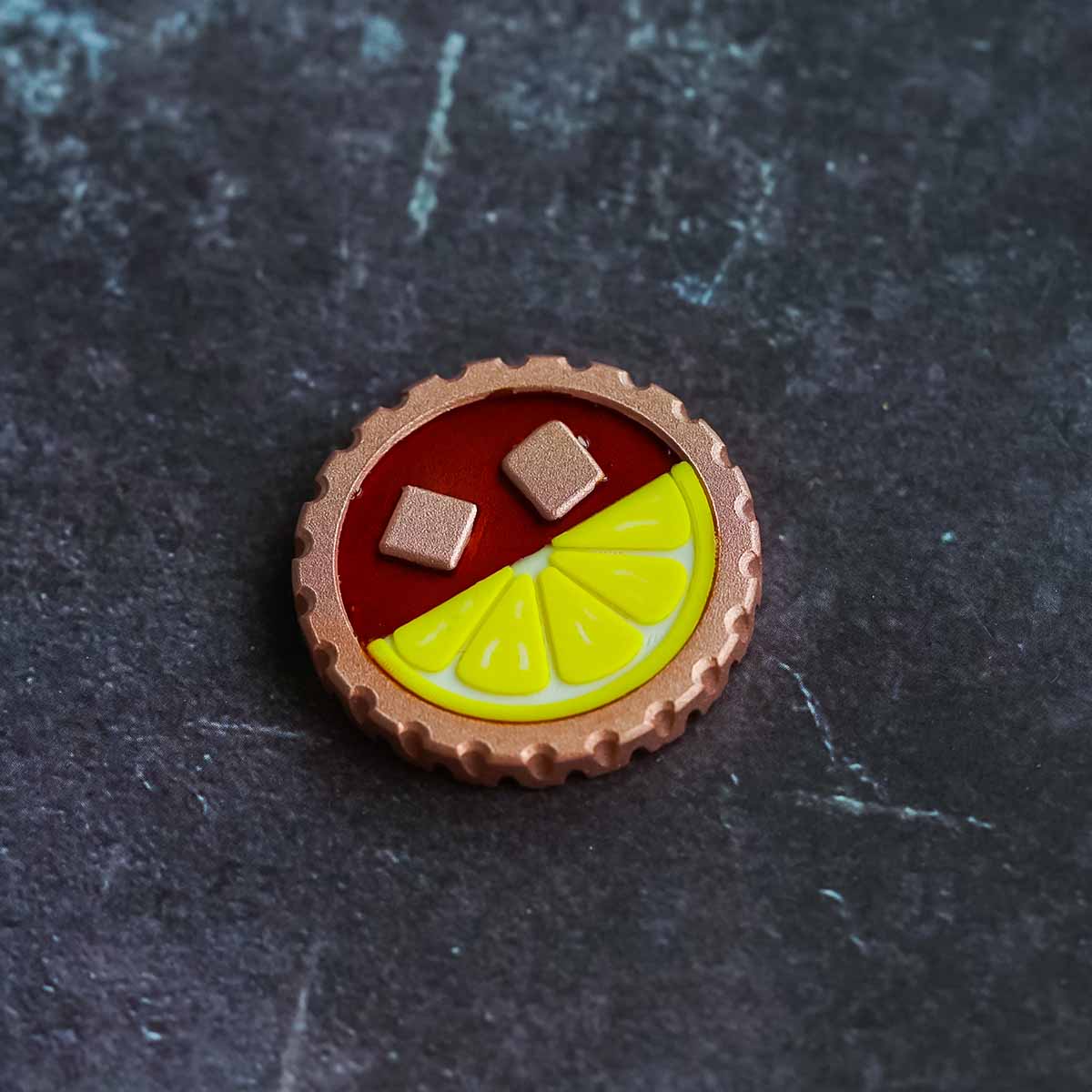 The Half & Half copper golf ball marker front view with clearfill drink finish