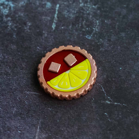 The Half & Half copper golf ball marker front view with clearfill drink finish