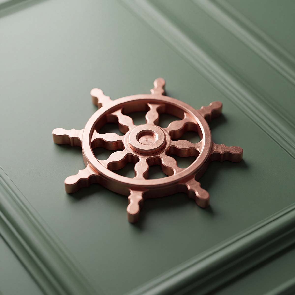 The Helm solid copper ship's wheel golf ball marker with eight spokes and raw machined finish