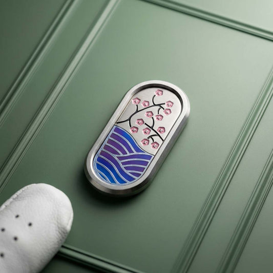 Tokyo Tide Marker stainless steel pill-shaped golf ball marker with Japanese orchids and torched wave inlay