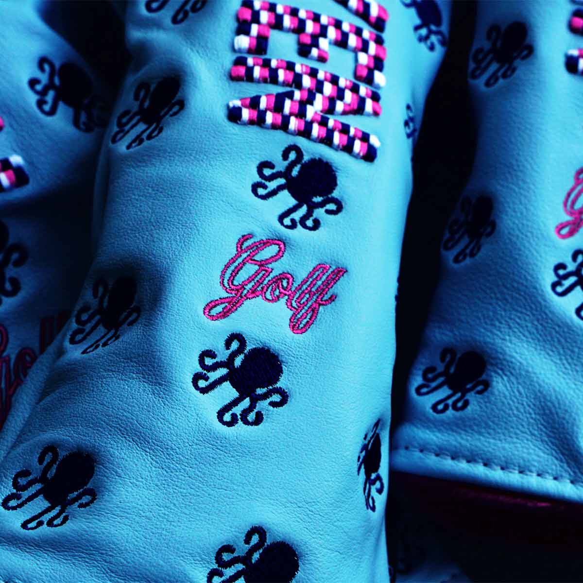 Navy blue Kraken logos and black Kraken tag on baby blue calfskin golf headcover
